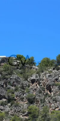 Prachtig luxe landgoed met drie villa’s en directe toegang tot de zee in Cala Boix, San Carlos